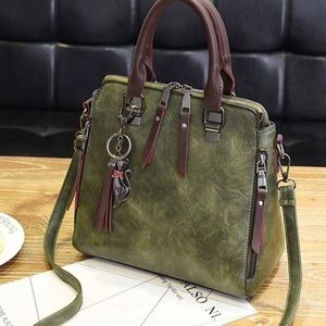 Gorgeous hunter green and brown handbag.